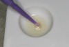 Figure 10  One to three drops of Brush&Bond were dispensed into a mixing well and stirred with a supplied Brush&Bond activator-containing microbrush for 2 seconds.